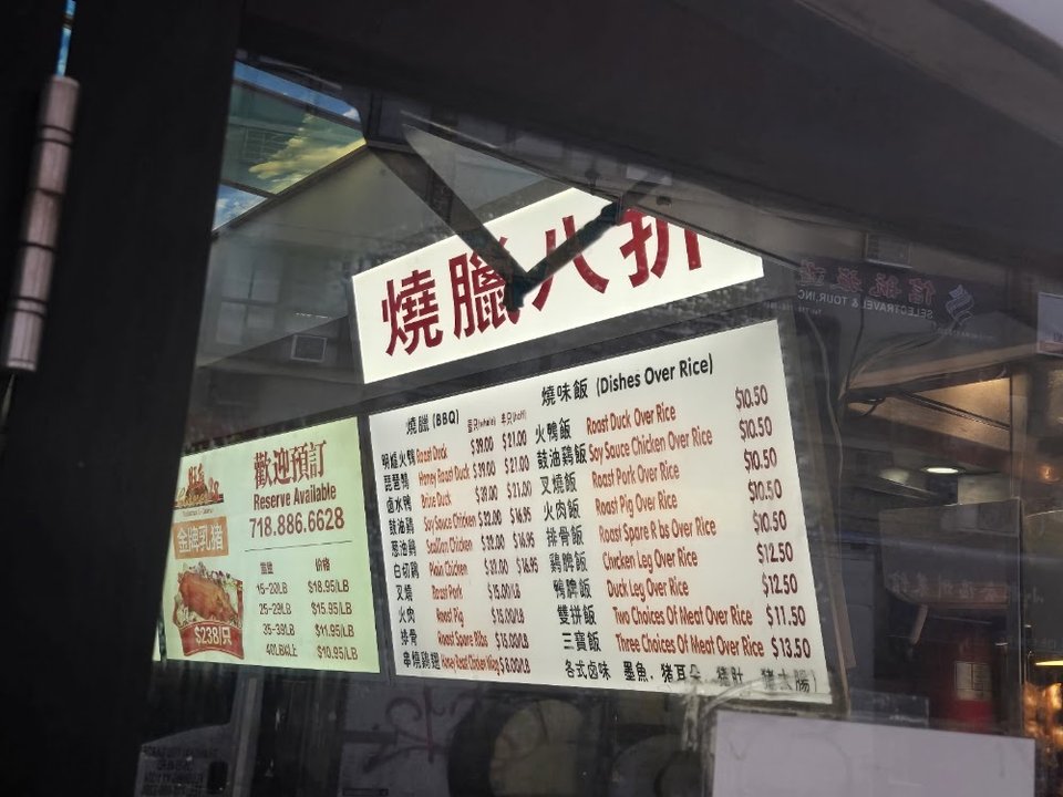 Roast meats, chicken, and rice dishes on paper.